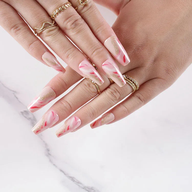 One Second Wearable Manicure press on nails showing rose, tulip, leopard and XINGX designs in blush colours
