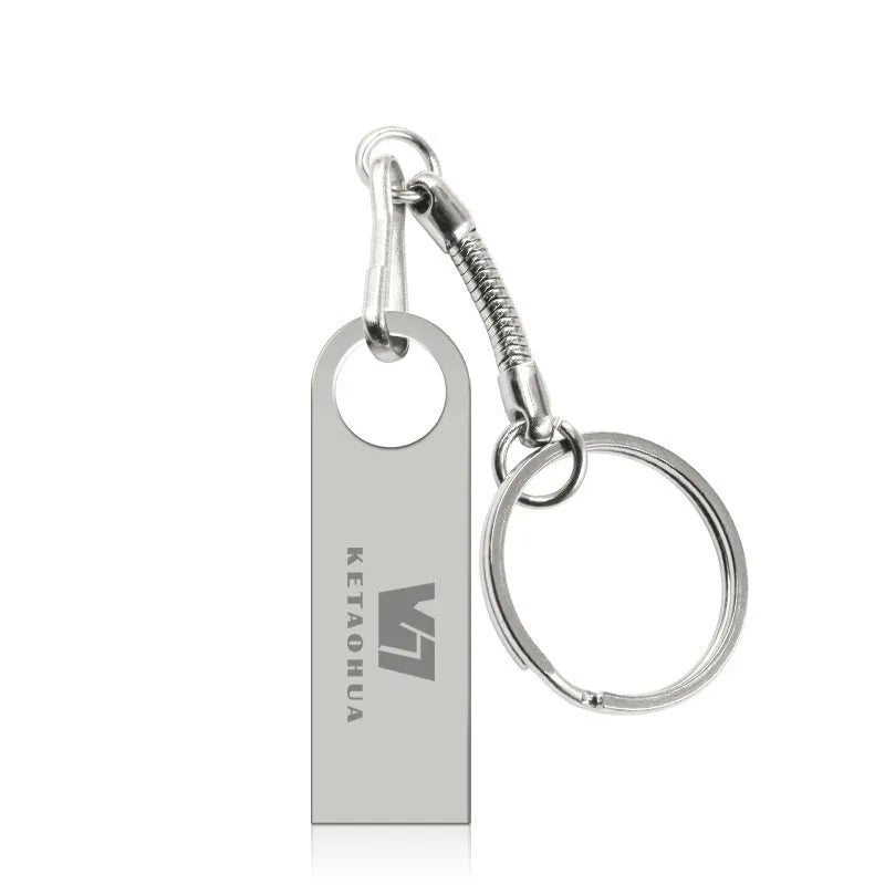 Silver metal USB flash drive shaped like a car on a black background.