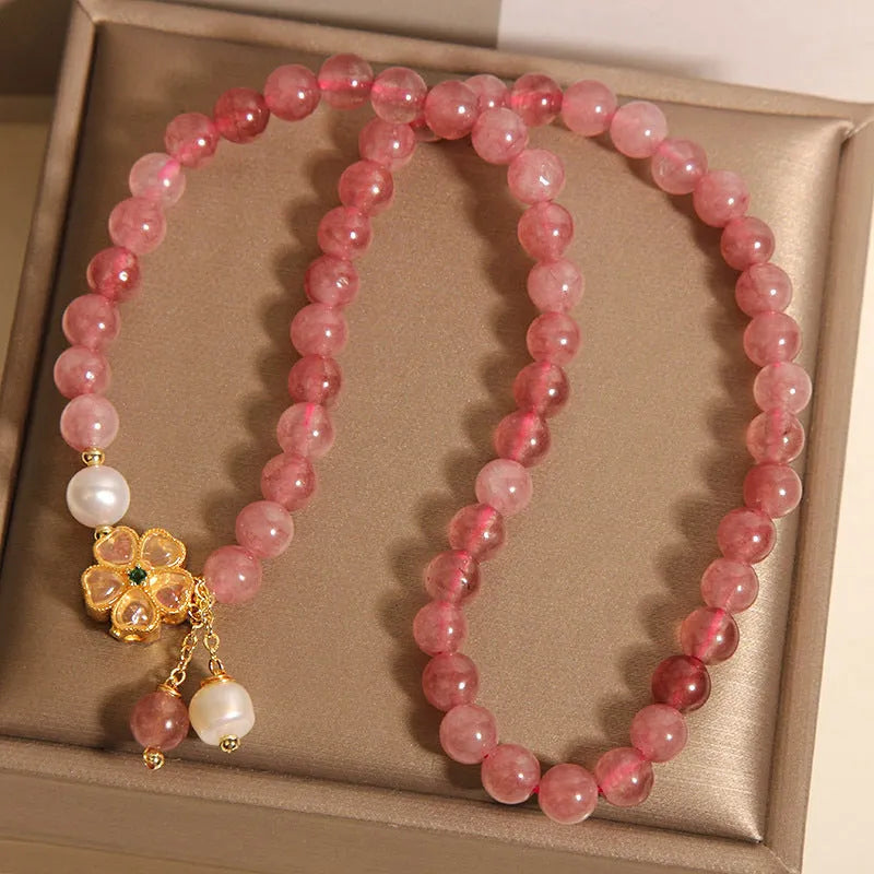 Women's double ring bracelet with strawberry quartz and four-leaf clover charm in Japanese-Korean style