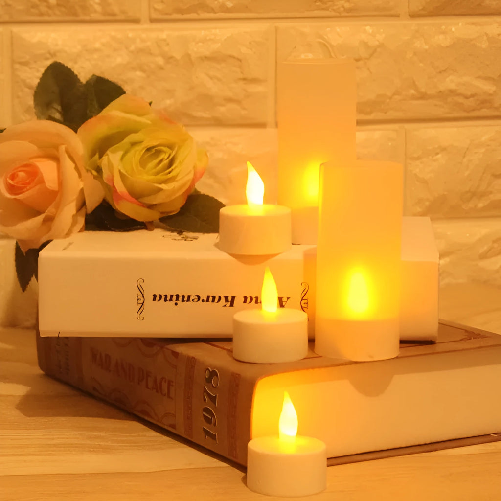 White plastic USB rechargeable LED candle lamp with flame-shaped head next to plastic cup and USB cable.