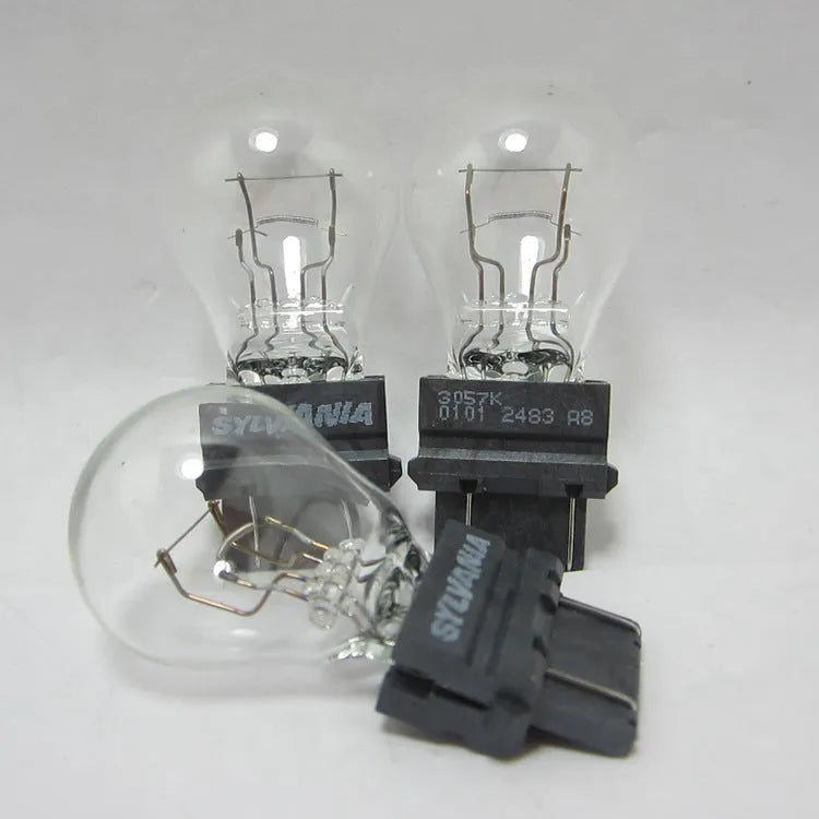 Wagner automotive brake light bulb with yellow glass and 16mm metal socket