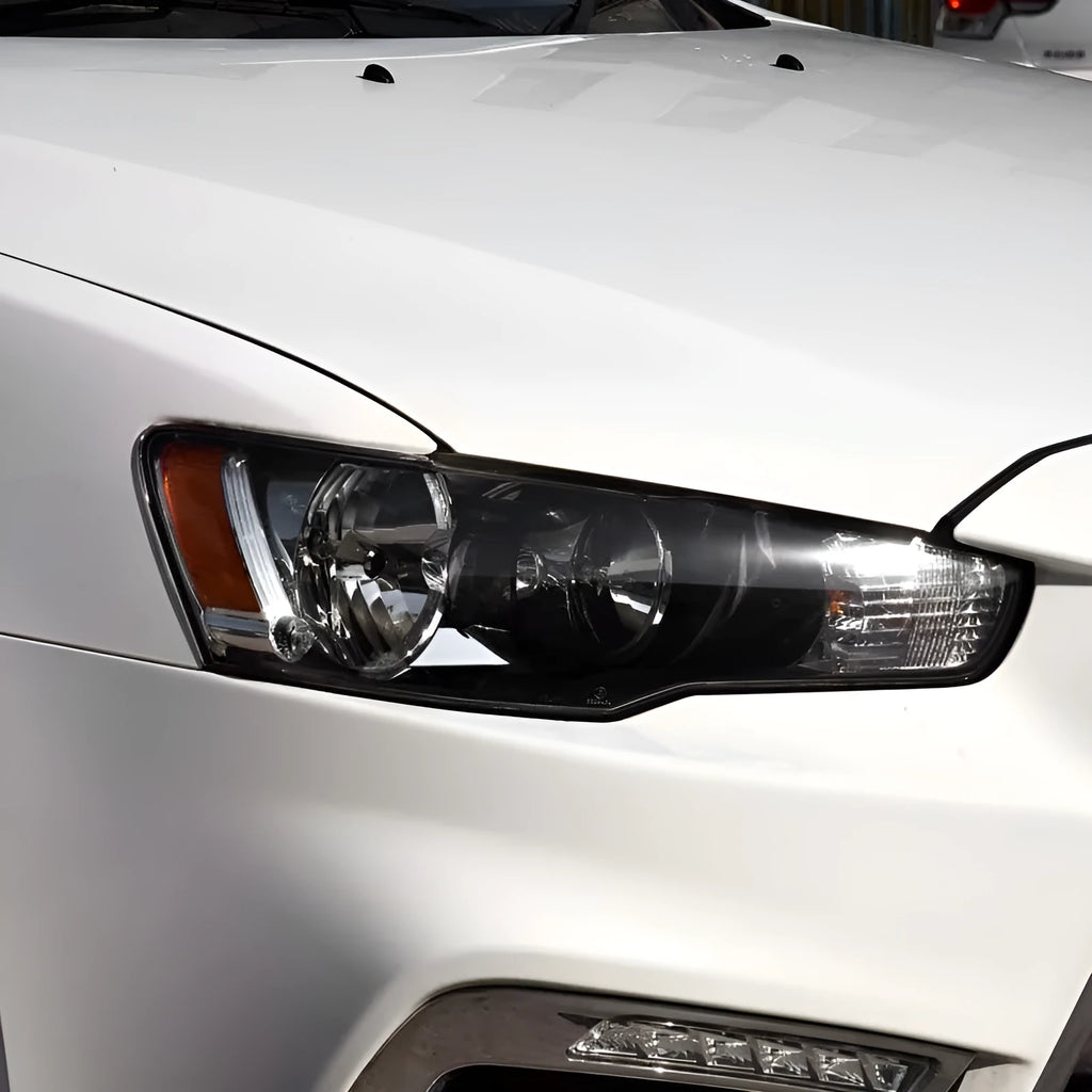 Transparent plastic automotive headlight housing cover showing clear construction