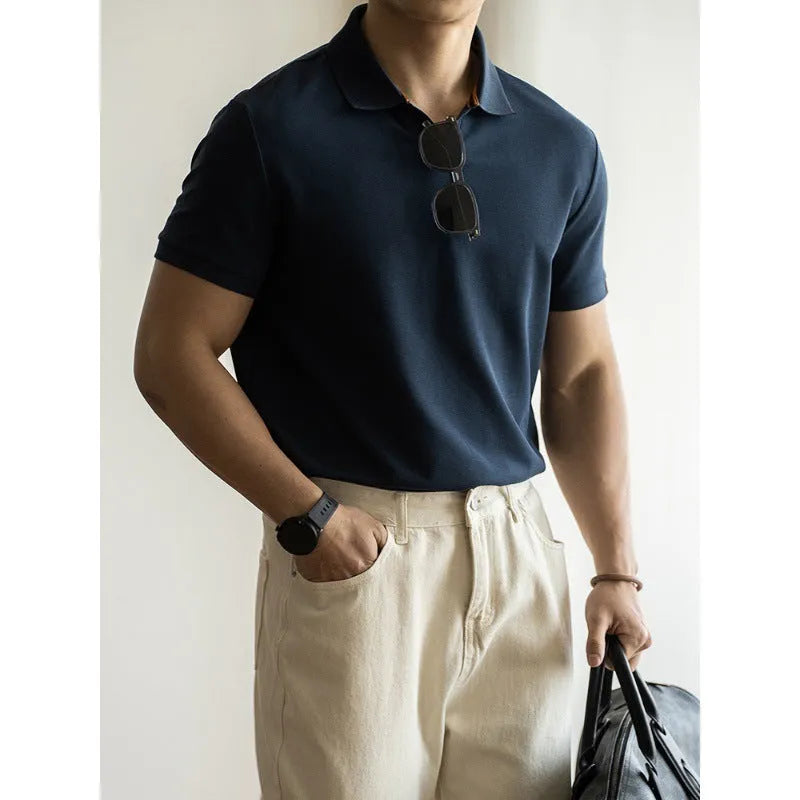 Men's blue short sleeve cotton polo shirt on a hanger, regular fit.