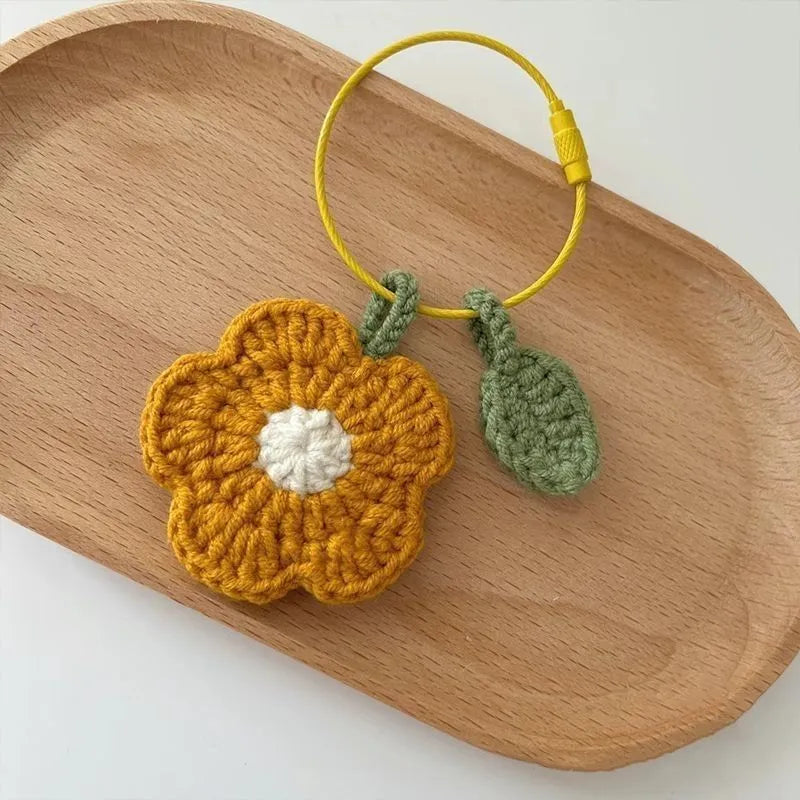 Hand crocheted wool flower pendant in red or yellow plush wool designs