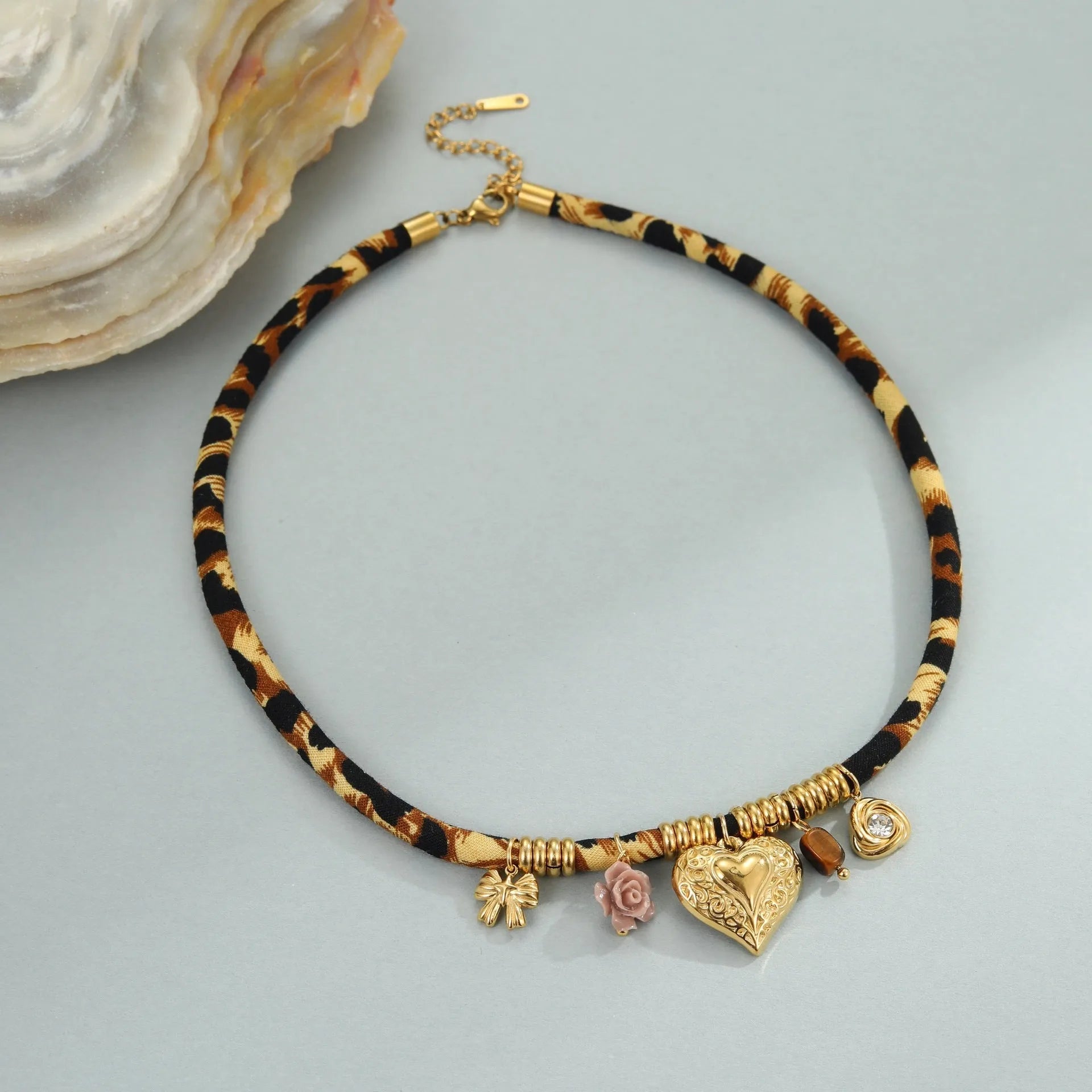 Gold geometric leopard series pendant on an adjustable stainless steel necklace chain.