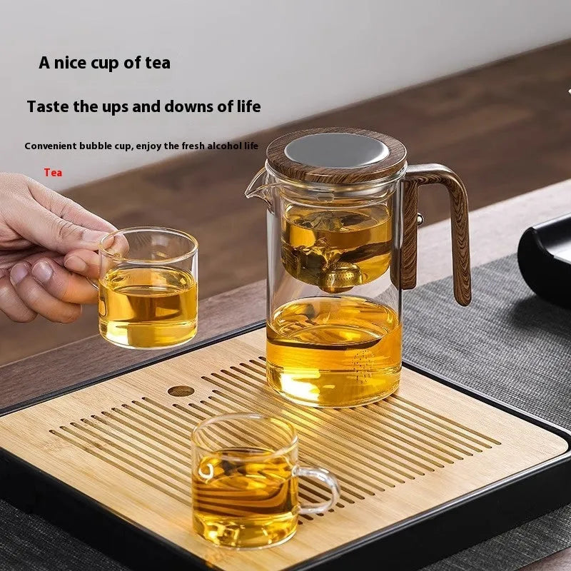 Glass teapot with wooden handle showing magnetic tea separation system and Chinese style design