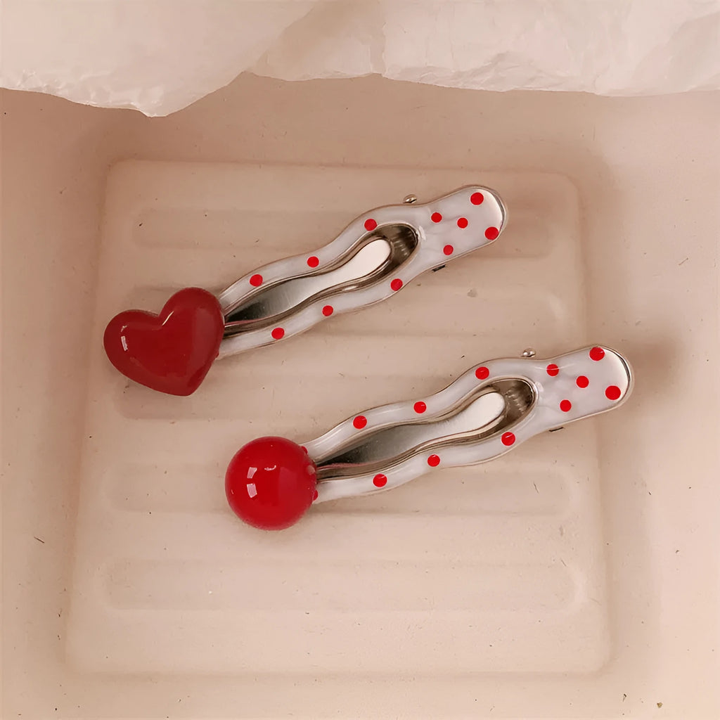 Red three-dimensional love heart-shaped hair barrette with retro dots and a willow leaf design.