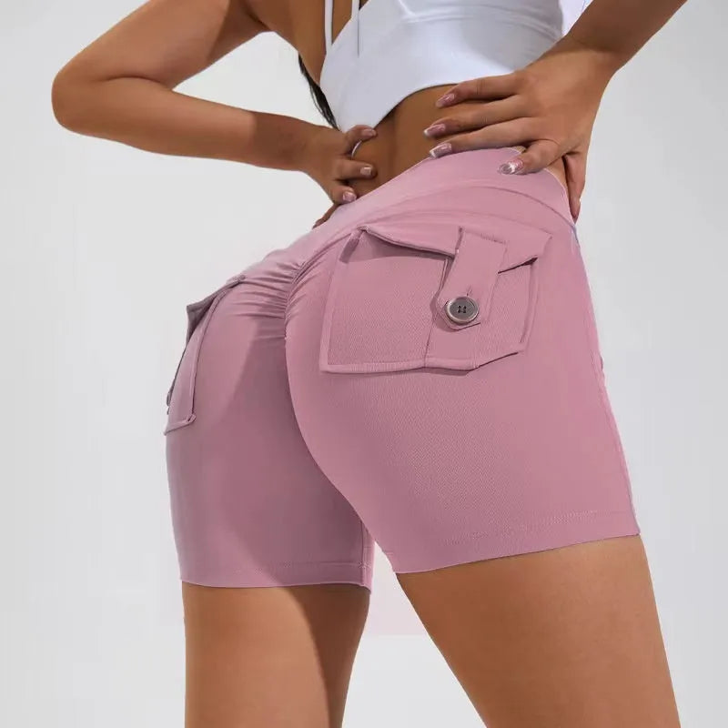 Women's high waist hip lifting shorts in avocado green with side pockets during yoga pose