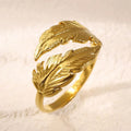 Women's adjustable opening feather fashion ring in silver or gold colour on titanium steel.