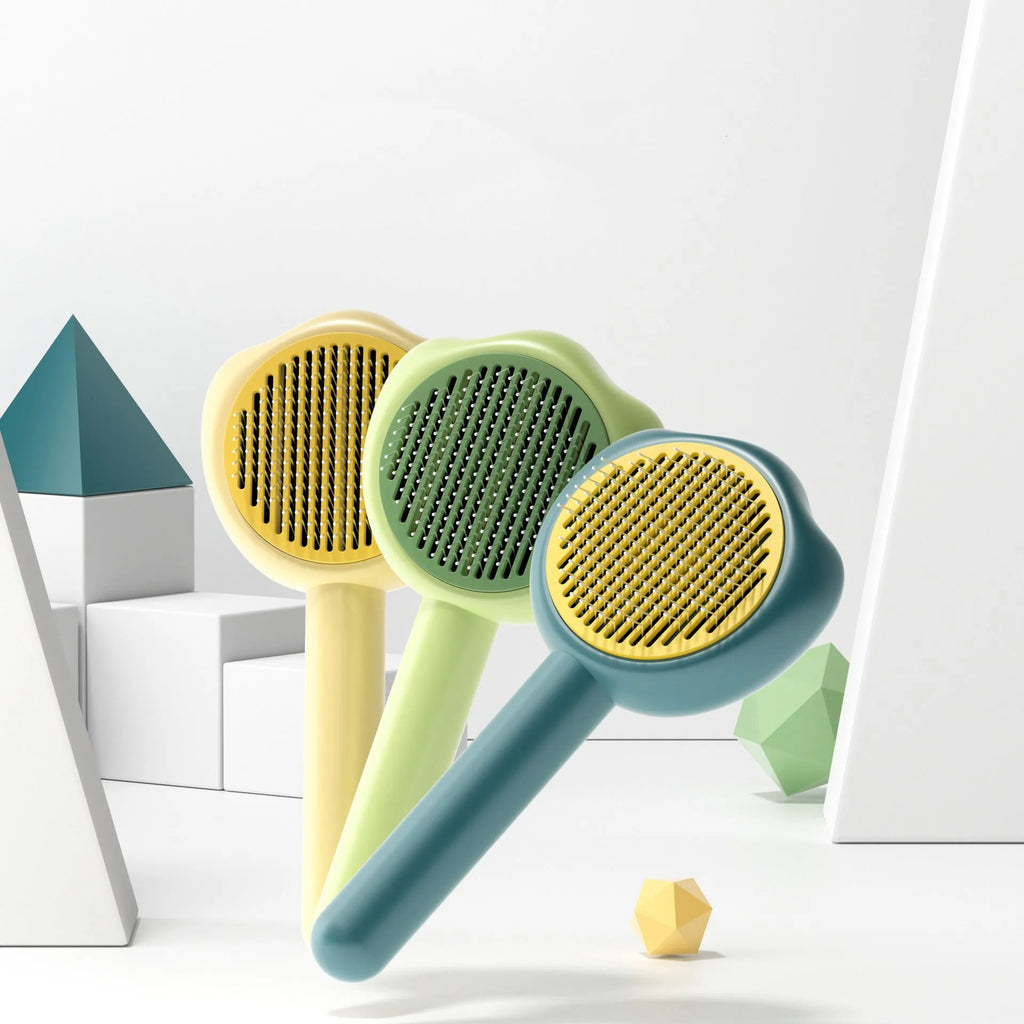 Pet grooming comb with self-cleaning needle teeth and cute handle in blue, green or yellow