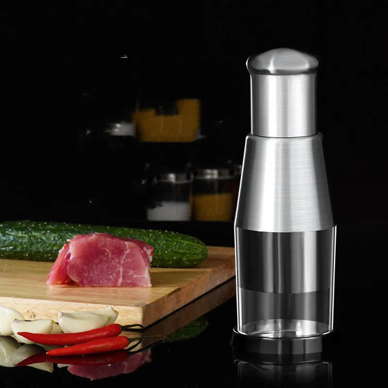 Manual garlic crusher and onion chopper with stainless steel blades on food-grade plastic base