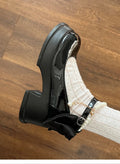 Black and beige women's chunky heel Mary Jane shoes with a round toe and shallow cut.